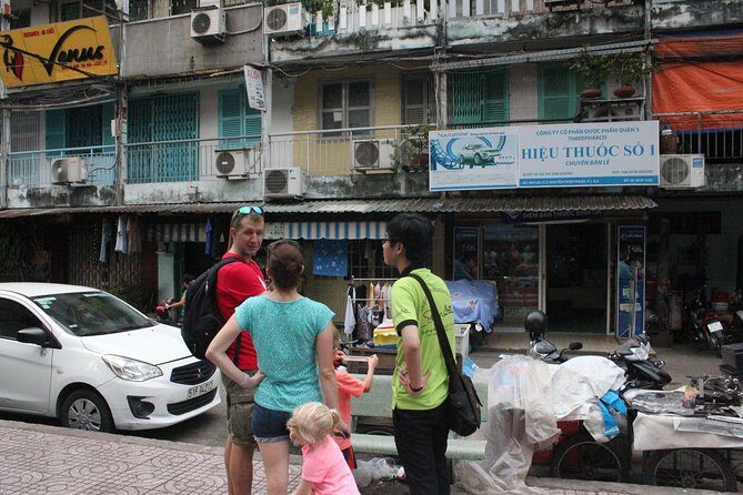 Afternoon Saigon Unseen Adventure by Scooter |Opt: Ao Dai Riders - District 7 ride-through, plus coconut and local conversations
