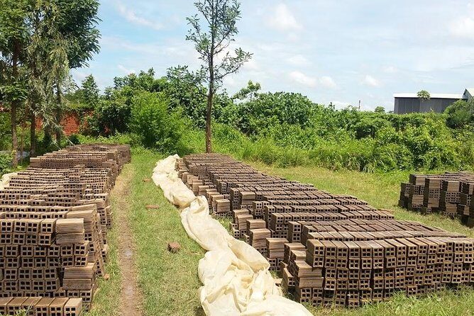 Authentic 'Non-Touristy' Mekong Delta Ben Tre 1 Day Private Tour - Sampan on the Ham Luong and rowing through coconut canals