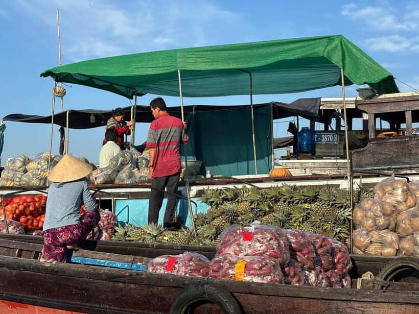Can Tho: Floating Market, Cacao & Canals with French Guide - Starting at 5:30 AM: the Can Tho pickup and wooden sampan vibe