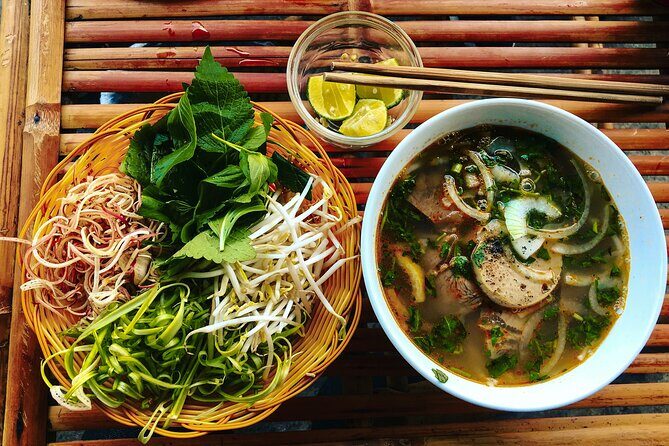 Private Local Food 4-hour Scooter Tour in Ho Chi Minh City - Stop 3: Bún Bò Xưa for Bun Bo Hue-style beef noodle flavors