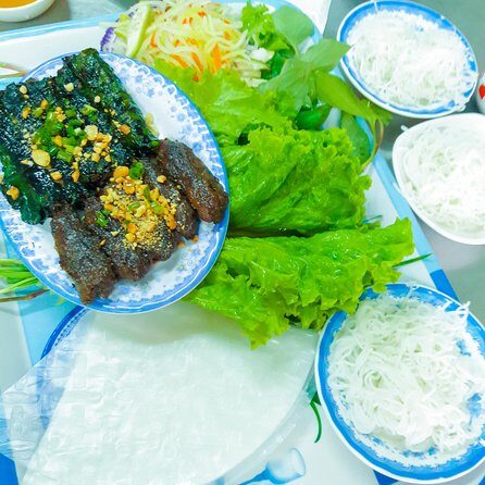 Private Street Food Evening Walking Tour in Ho Chi Minh City - Drinks: beer and homemade Vietnamese rice wine, handled with care