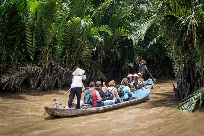 Private Tour to Explore Cu Chi Tunnels and Mekong Delta - Coconut candy factory, honey tea, and canal sampan rides