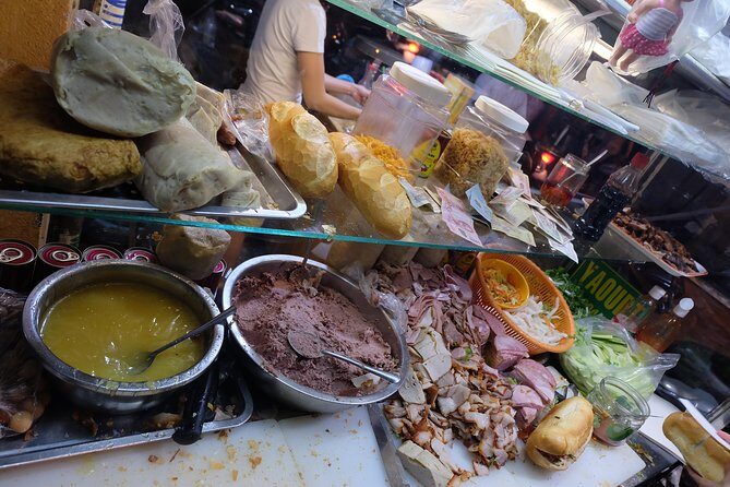 Saigon After Dark and Street Food by Motorbike and Scooter - BBQ Street dinner: seafood, grilled snacks, and local beer