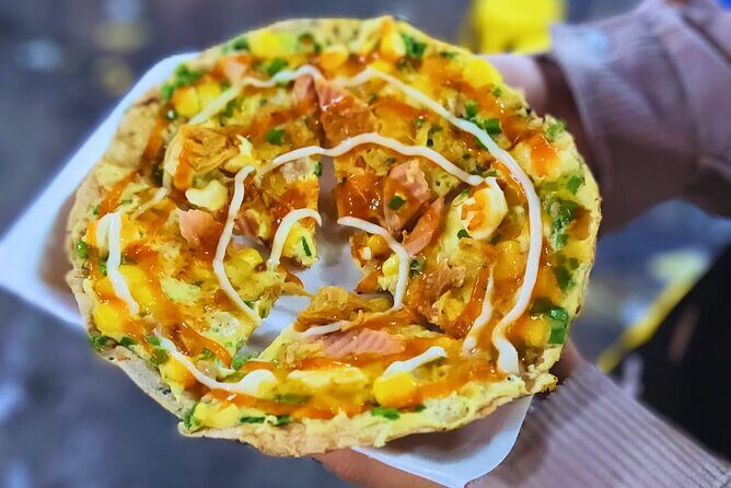 Saigon Food Tour by Scooter with Eleven Tastings - District 10 street-food walk: fried bao buns and crunchy favorites