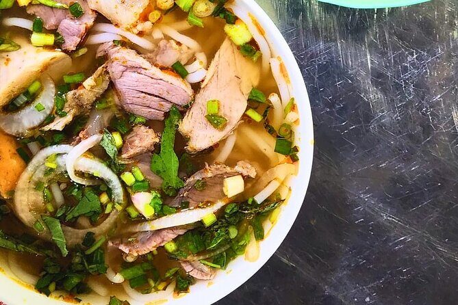 Saigon Food Tour by Scooter with Eleven Tastings - Old apartment-area comfort: sugarcane juice and bún bò Huế