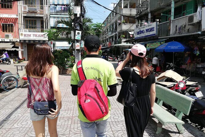 Saigon Night Scooter Experience And Local Food - District 3’s old apartments: life for working people, not just famous sights
