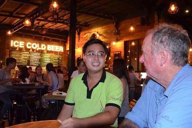 Saigon Night Scooter Experience And Local Food - Thich Quang Duc and war-era stories at coffee stops