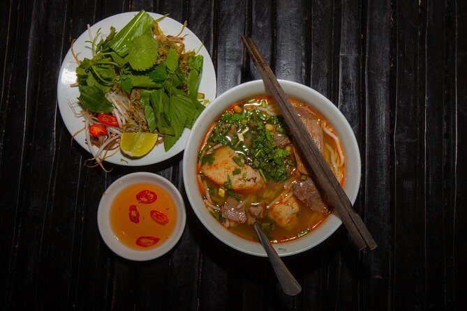Saigon Night Street Food and City Tour on Scooter - Scooter comfort: what to wear, what to bring, and how to avoid awkward moments