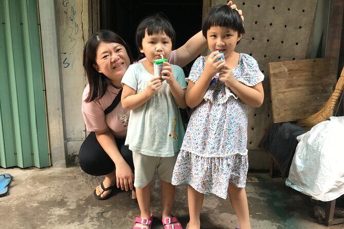 Saigon Slum tour and Saigon Chillspots by motorbike/ Aodai rider - Charity-food stop and local bites: where the tour turns from viewing into doing