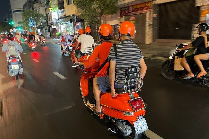 Saigon Vespa By Night Street Food With Female Riders Ao Dai - A 6 pm Vespa loop: how Saigon night scenes fit food