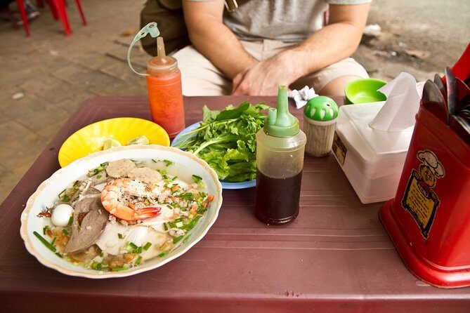 Small-group Street Food Lover by Motorbike (04 hours) - Stop 1: Ho Thi Ky Flower Market and vendor cooking demonstrations
